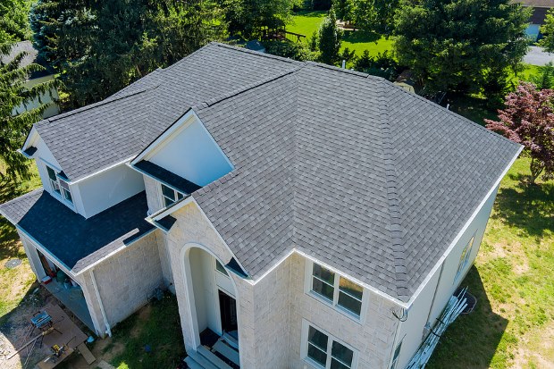 Circle white outline showing hail damage on asphalt shingles